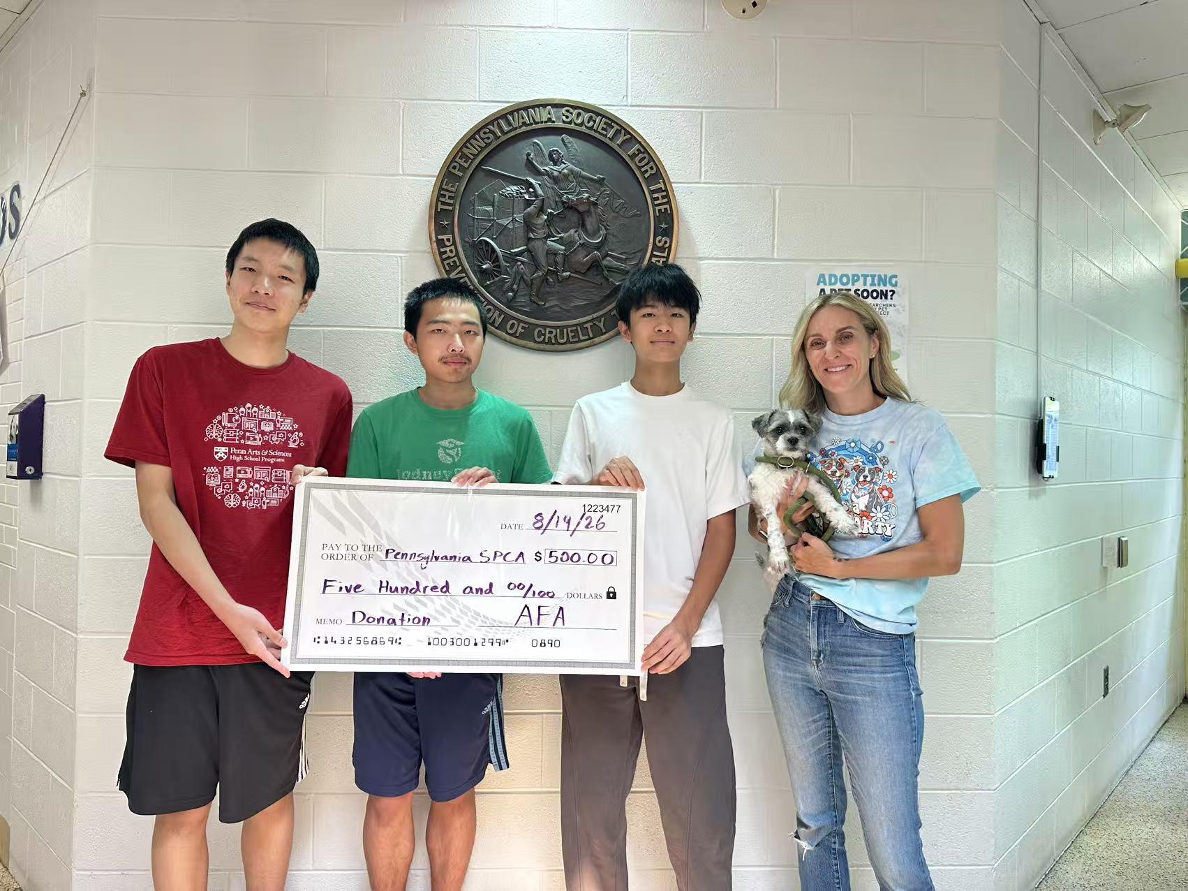 Adolescents for Animals members presenting a $500 donation check to the Pennsylvania SPCA, August 2026